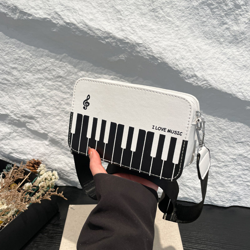 2025 invierno nueva moda color contraste pequeño bolso cuadrado niña dulce personalidad piano notas pequeñas bolso femenino portátil