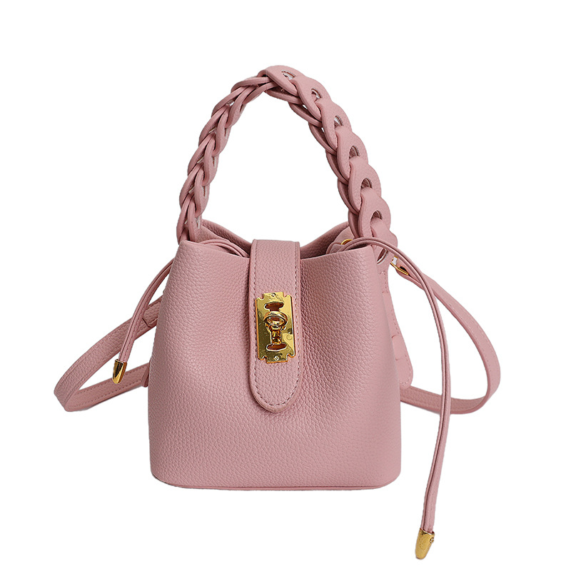 Bolsos de balde portátiles de alta calidad para mujeres 2026 verano nuevo lichi estampado viaje diario ocio versátil mochila
