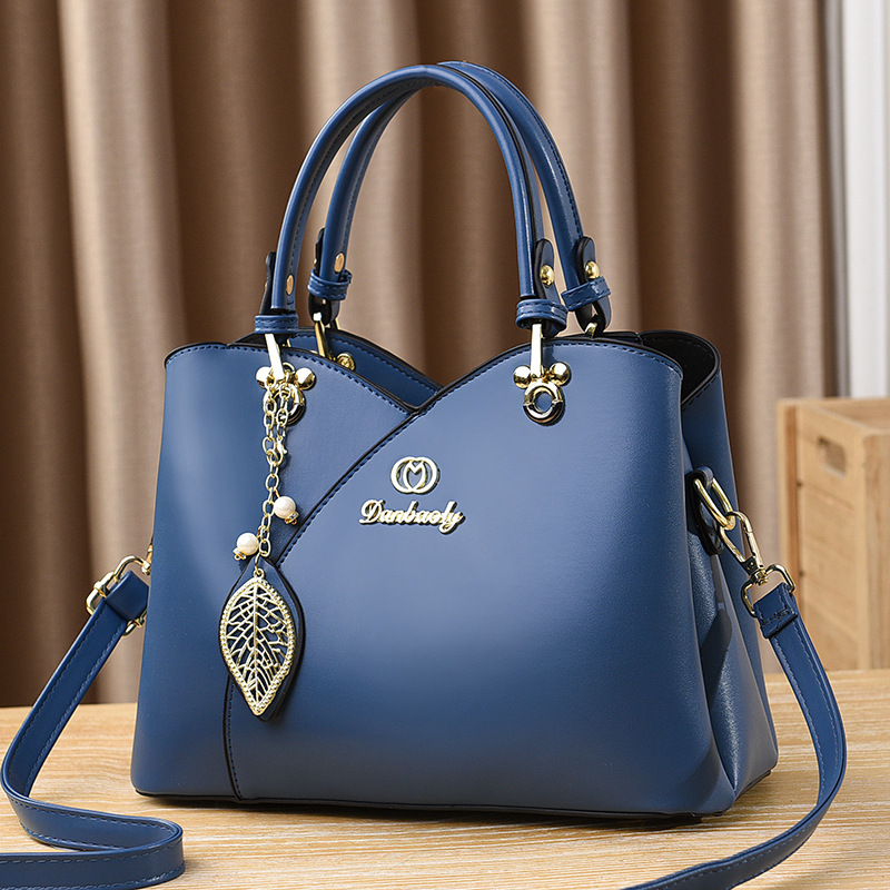 Bolso bandolera para mujer nuevo versátil bolso de mamá moda de verano bolso de mano de un solo hombro 2025 fabricante comercio exterior elegante para mujer.