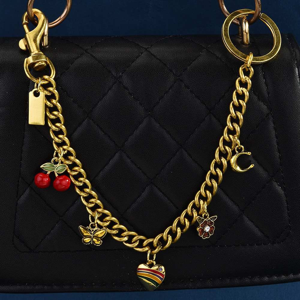 Nuevo estilo transfronterizo europeo y americano venta caliente dinosaurio amor concha cereza herradura fresa manzana bolso de cadena colgante bolso de mensajero mujer