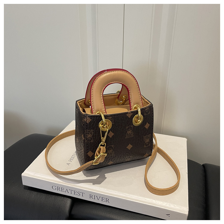 2026 nuevo bolso infantil caricatura lindo oso impresión bolso de hombro de moda mini bolso de bebé