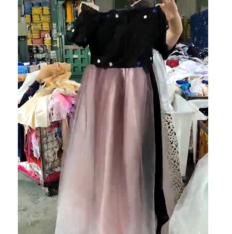 Second-Hand Clothes Are Sold by the Pound in Africa. Cross-Border Supply of Old Wedding Dresses and Long Skirts Are Mixed Second-Hand Clothes Are Sold by the Pound in Africa. Cross-Border Supply of Old Wedding Dresses and Long Skirts Are Mixed