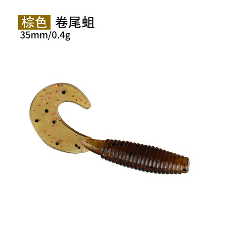 Factory-supplied bulk soft lures—curly-tail grubs for lure fishing, lead-head hooks, Texas rig setups, and salt-infused, fishy-smelling soft worms.