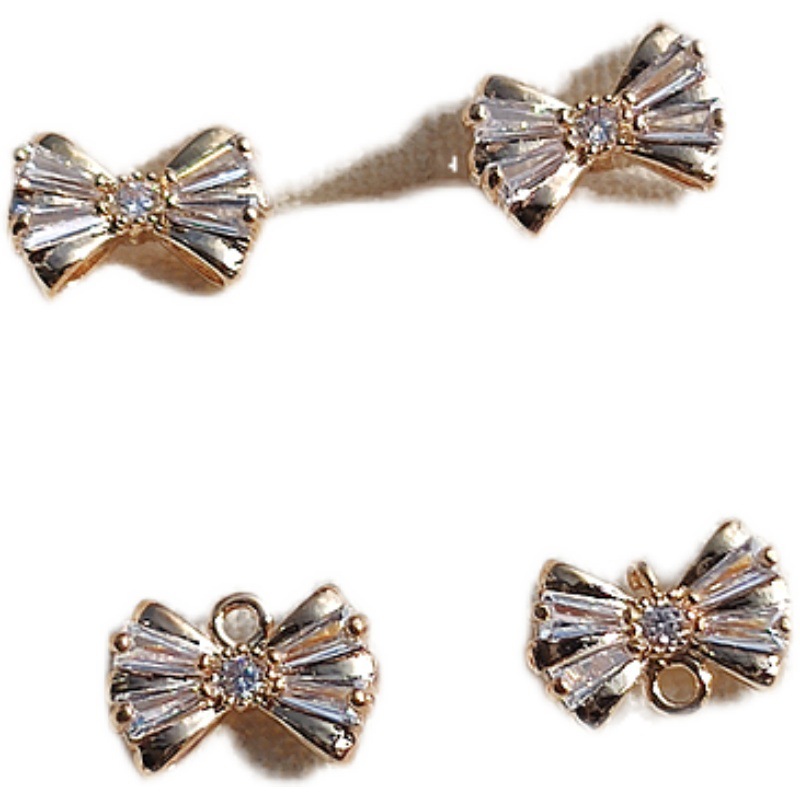 Copper earrings with zircon with bow