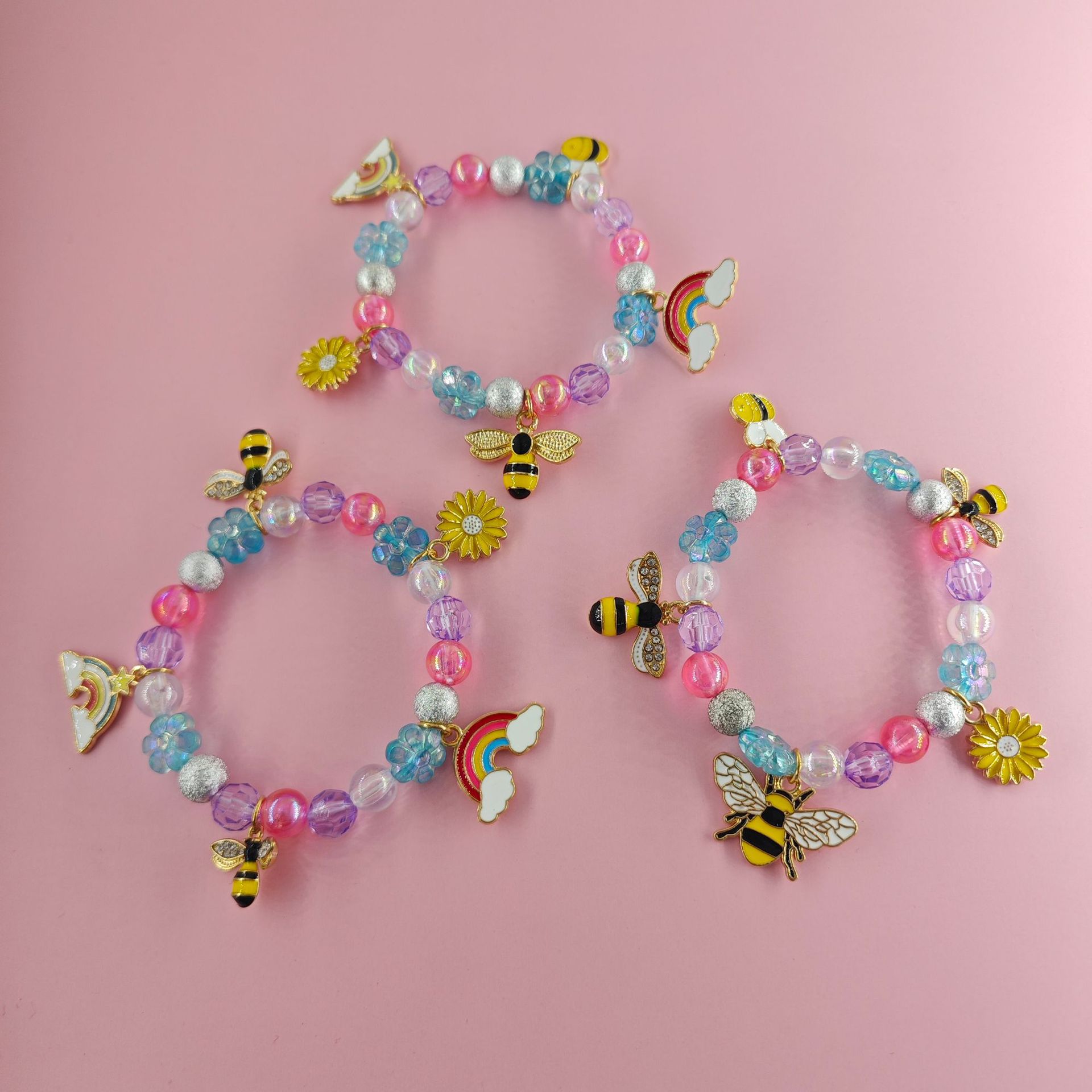 Transfronterizo Amazon nueva pulsera de dibujos animados para niños pequeña margarita abeja colgante de arco iris pulsera variedad de joyas de amistad