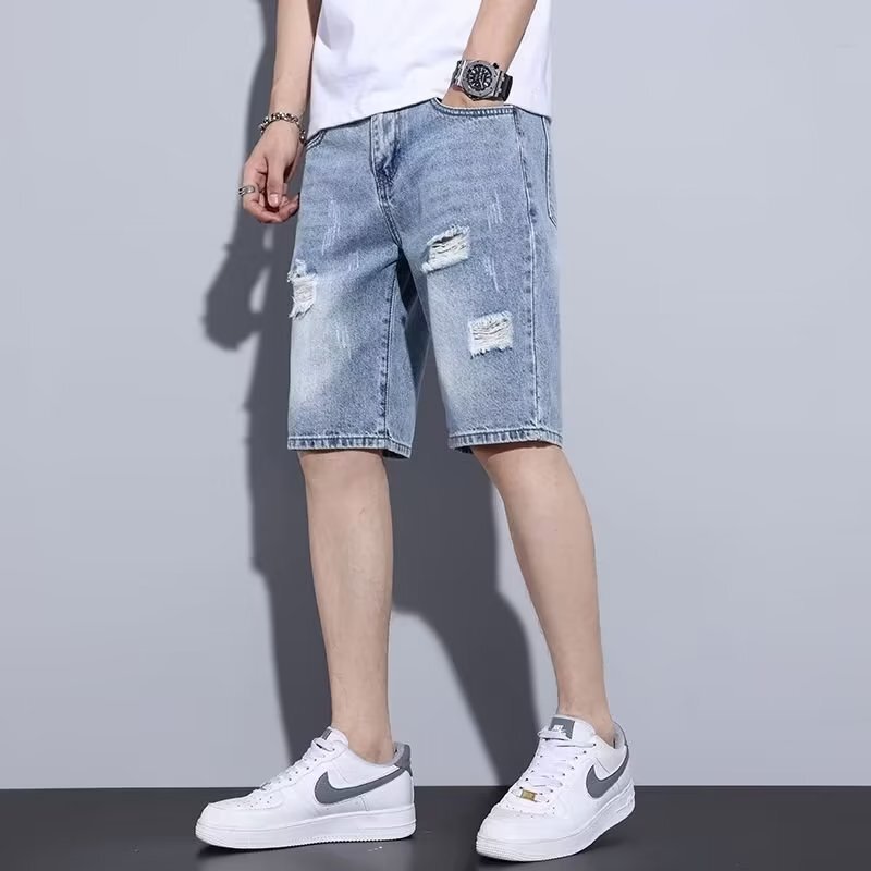 男性のズボンのカジュアルな穴が開いているデニムの半ズボンの男性の夏の薄いタイプの外はinsの潮の百合のゆったりしているストレートな男性のズボンを着ます。|undefined