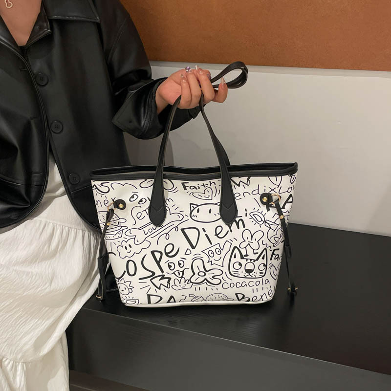 Nicho de diseño de graffiti bolso para mujeres 2025, nuevo bolso de hombro de mano casual, bolso de brazo de viaje de gran capacidad