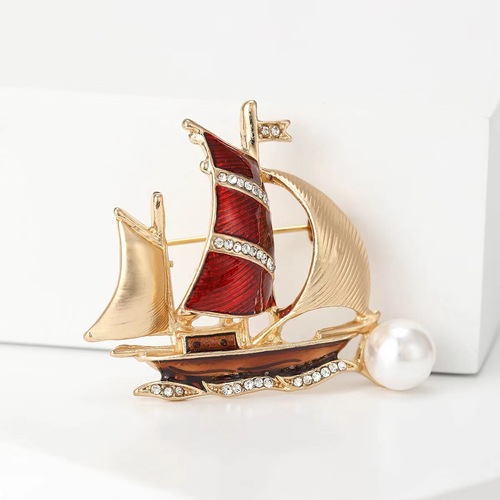 High-end temperament Korean-style brooch for women, featuring a oil ship sail design, with pearls and a stylish anti-slip fastener, elegant and fashionable.