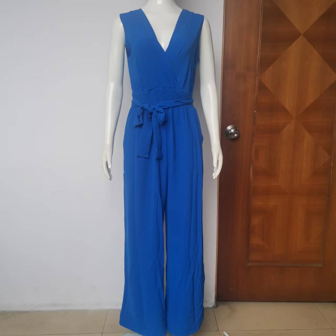 Ropa de mujer europea y americana 2024 primavera nuevo color sólido con cuello en V sin mangas con cordones cintura alta suelta pierna ancha Pantalones de mujer