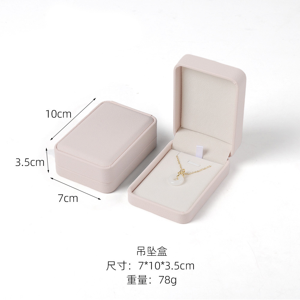 Caja de joyería rosa de alta calidad de cuero pu caja de embalaje de marca de joyería logotipo colgante pulsera collar caja de anillo