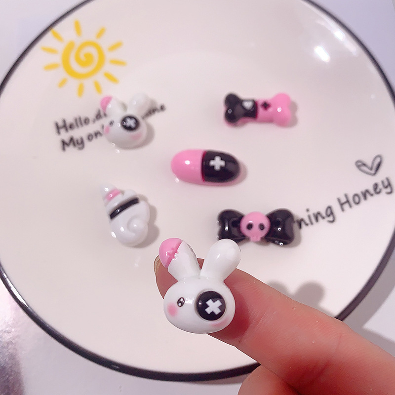 Caricatura dulce serie cool cráneo arco accesorios de resina DIY pegamento crema caja de teléfono móvil adornamiento de cabello agujero botón de zapato