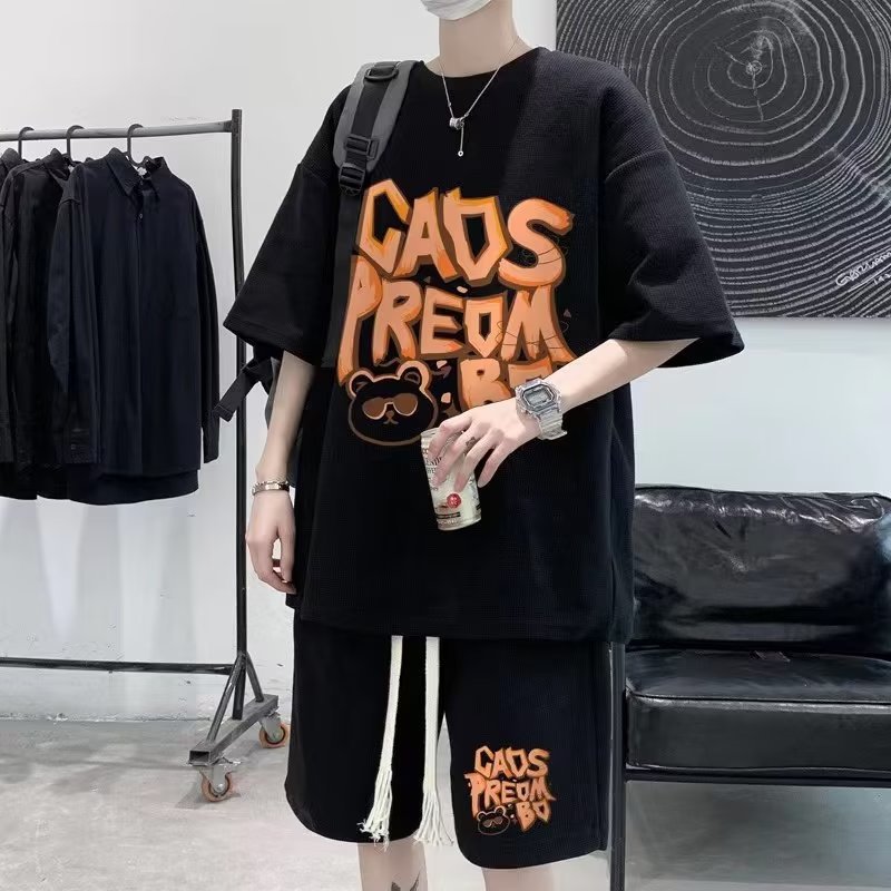 Suministro directo de fábrica traje de waffle verano de los hombres de manga corta Camiseta marca de moda juvenil ropa deportiva casual de dos piezas