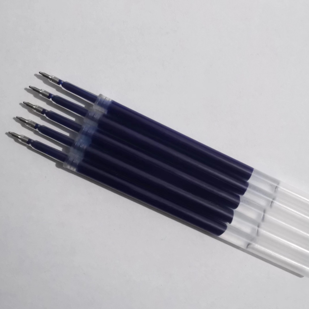 Transparent rod, blue ST tip, press-to-open pen refill