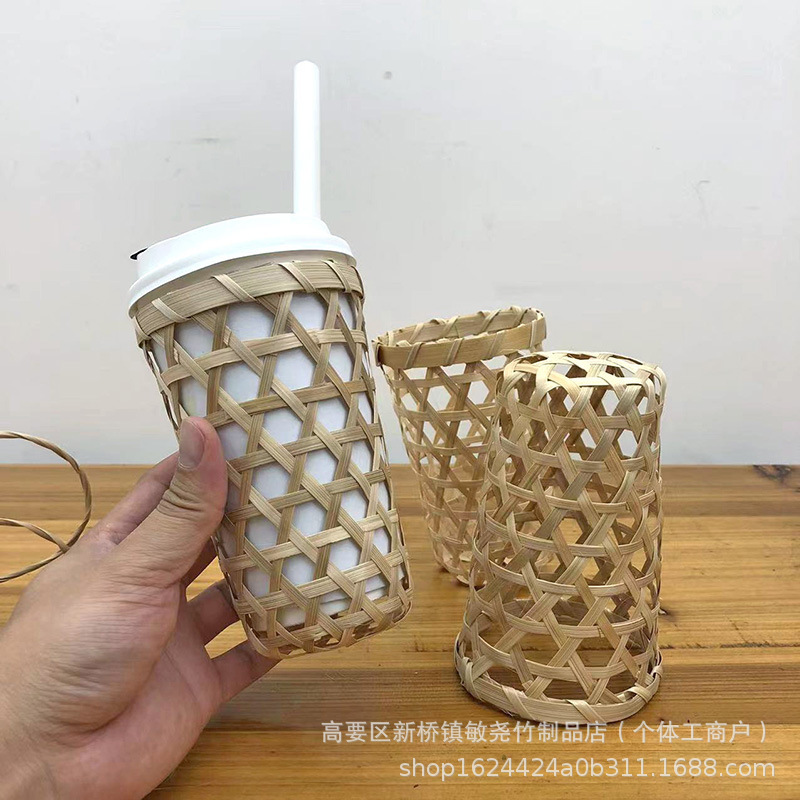 竹編みミルクティーカップカバーの透かし彫りデザインの田園の雰囲気は生け花の竹のかごの装飾の逸品を作ることができます。|undefined