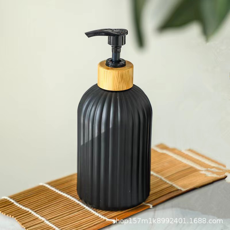 Botella de emulsión de vidrio de lujo ligeramente nórdica botella de jabón de presión botella de champú de baño de alto valor facial