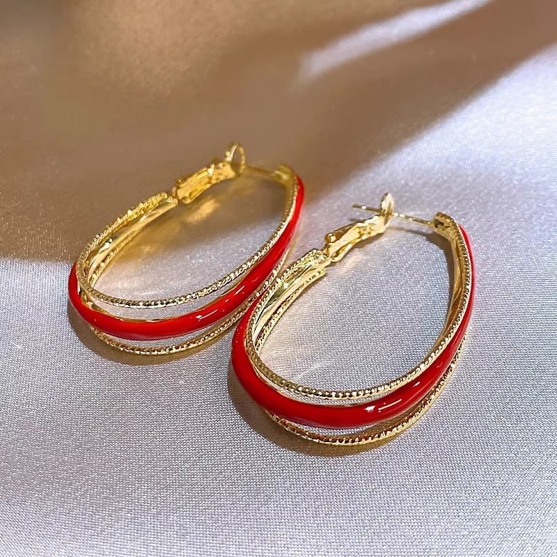 Pendientes de amor con goteo de aceite rojo con aguja de plata, botones de oreja de temperamento de moda de nicho, pendientes simples y de alta gama de estilo de Hong Kong