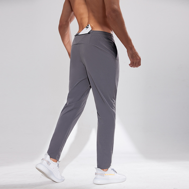 Pantalones deportivos al aire libre Otoño e Invierno hombres corriendo fitness pantalones de secado rápido sueltos transpirables deportes casuales pantalones de entrenamiento de secado rápido