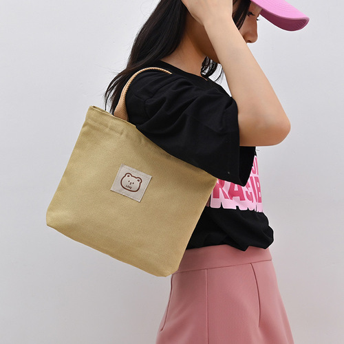 Niche Japanese canvas handbag, large-capacity commuter lunch bag, simple and versatile storage bag for office workers