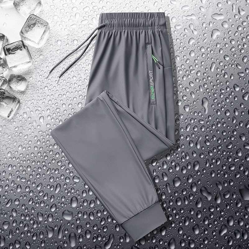 Pantalones deportivos casuales de seda de hielo para hombres pantalones de verano finos de punto de oro elásticos de secado rápido casuales atados al tobillo más pantalones de tamaño