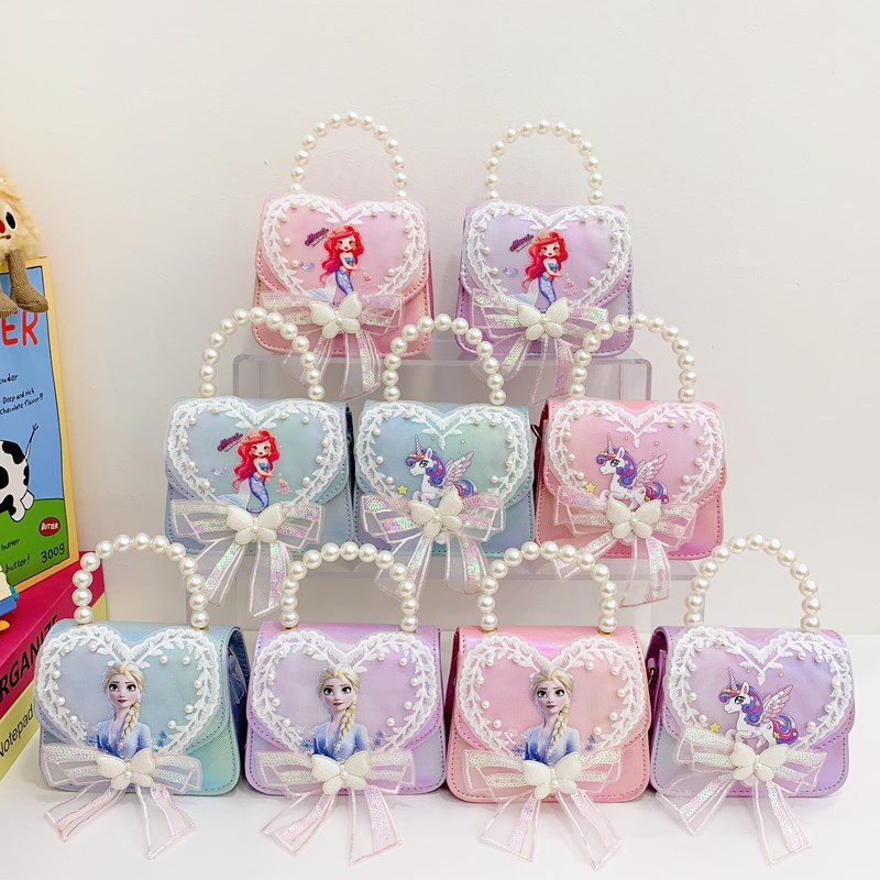 La niña transfronteriza Aisha bolso de hombro de este año, bolso de perla de moda popular, bolso de hombro para niños coreanos.