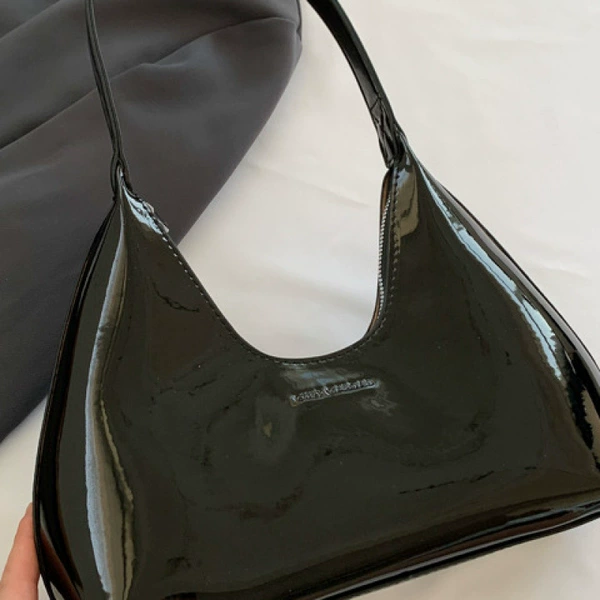 Glossy, black, capacious