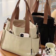 オリジナルの多ポケットの通勤バッグは、キャンバスのトートを厚くしています。