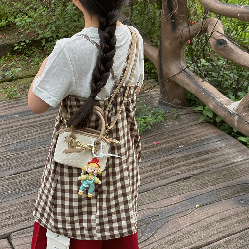 Bolsos de mano para niños lindos colgantes extranjeros mini bolsos de hombro para niños y niñas de color sólido simple bolsos de conchas de niños de moda