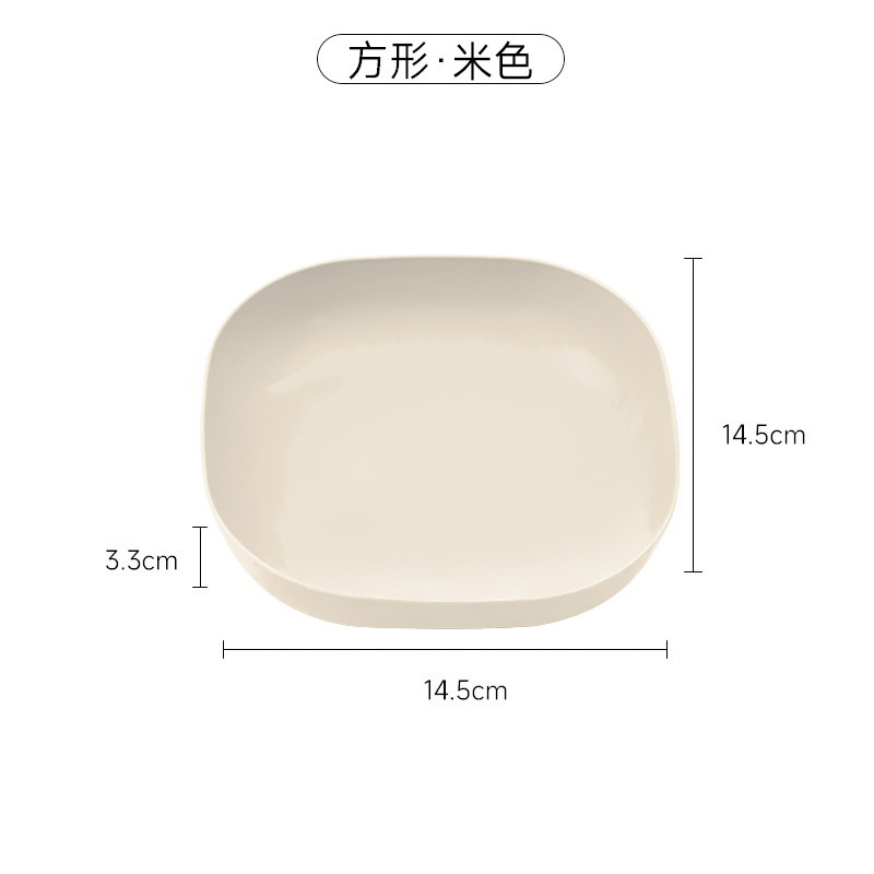 骨の皿を吐く日本の家庭用創意プラスチックの食卓に野菜の皿を置いて骨の皿の小さい皿の果物のキャンディーの皿を吐く。|undefined