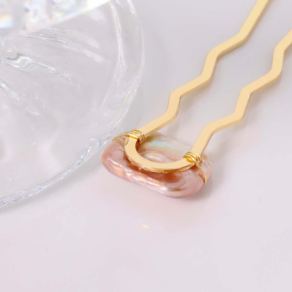 Perla de alta sensación en forma de U clip de cabello bola cabeza fija artefacto clip de cabello nuevo peine de cuatro dientes joyas al por mayor