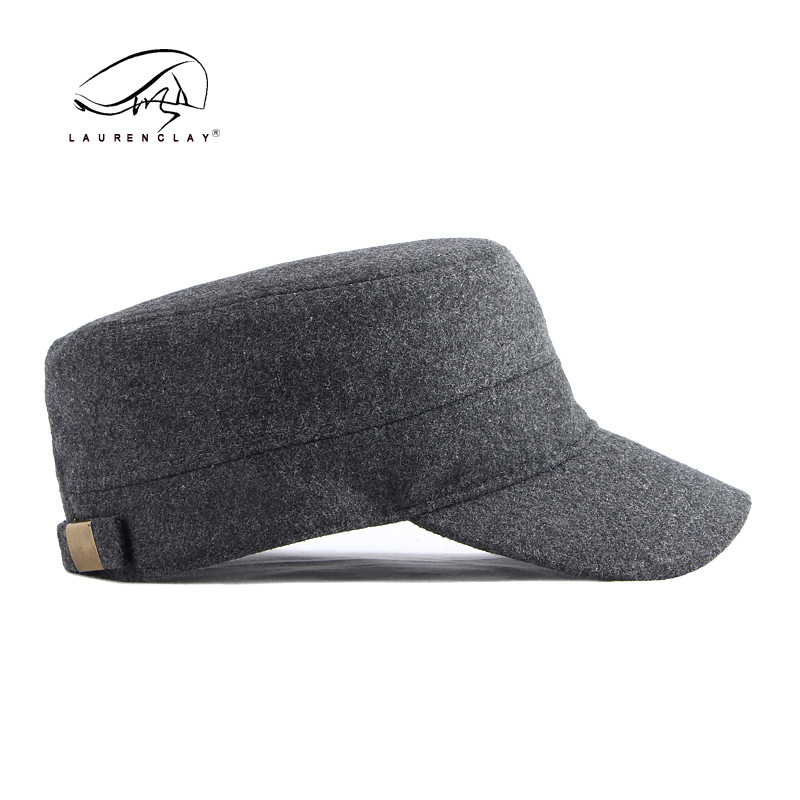 Sombrero al por mayor de los hombres otoño y el invierno lana caliente sellado completo casquillo enarbolado simple luz tablero superior plana azul marino sombrero