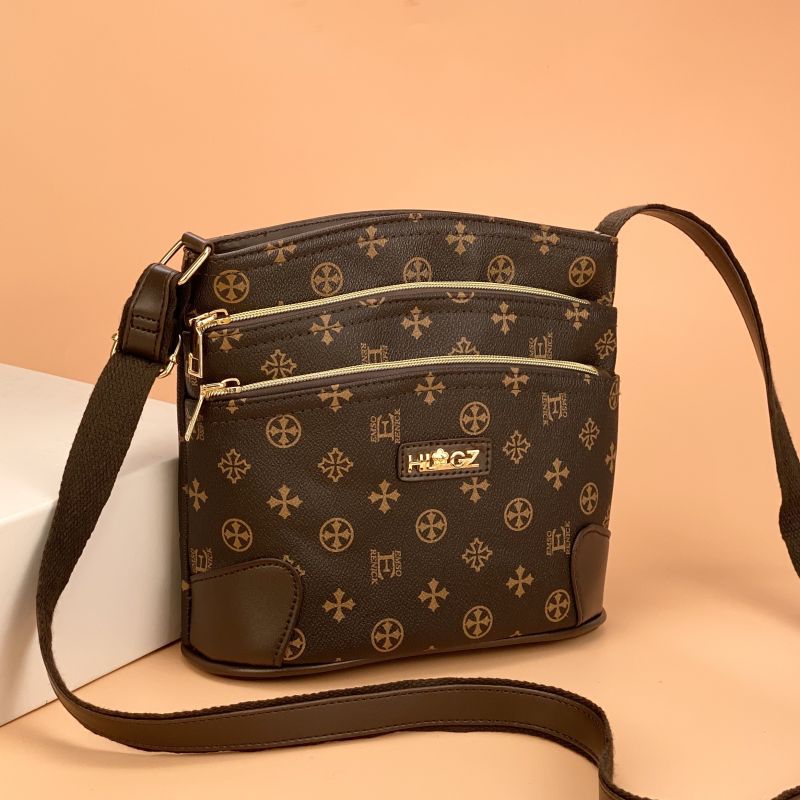 Guangzhou Hengli equipaje para mujer 2025 nuevo estilo coreano bolso de mensajero de un solo hombro bolso de cubo madre de mediana edad bolso de varias capas mujer