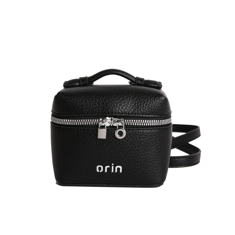 2026 nuevo bolso infantil coreano litchi patrón bolso de caja para hombres y mujeres bolso de cambio de color sólido mini