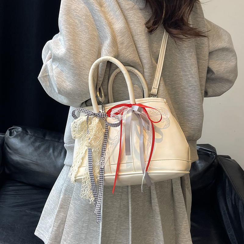 Bolsos de jardín portátiles populares de este año para mujer 2025 nuevos productos bolsos de hombro coreanos de nicho bolsos de cubo de todo fósforo de alta gama