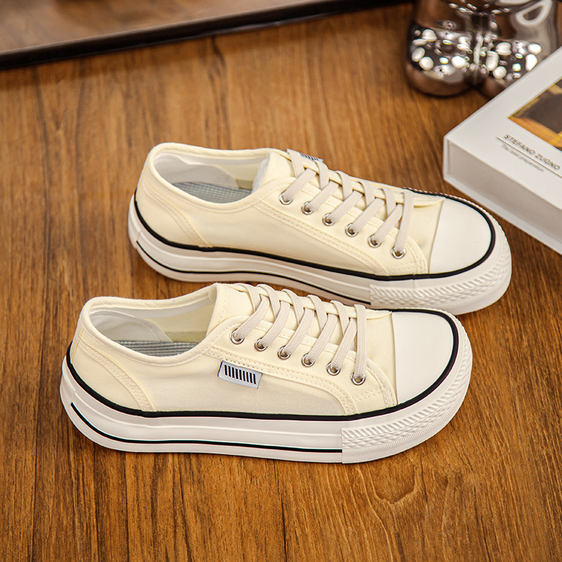 2026 primavera y verano nuevos zapatos de lona de mujer de altura baja con suela gruesa delantera correa de abertura superficial zapatos de lona casuales de estudiantes