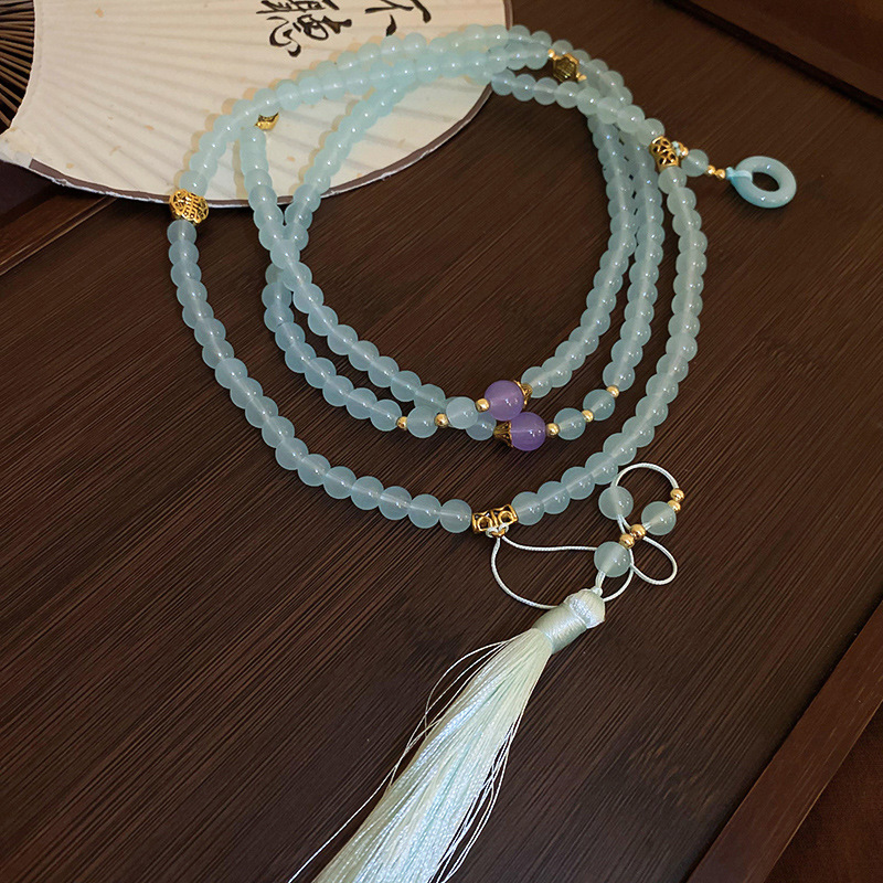 Estilo antiguo Zen azul azul vidrio borla collar nuevo estilo elegante estilo chino tapeta de presión cadena lateral estilo caliente falda de caballo accesorios mujeres