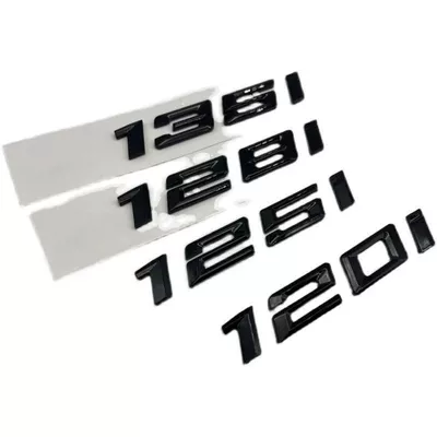 Car logo: features a glossy black emblem, lettering