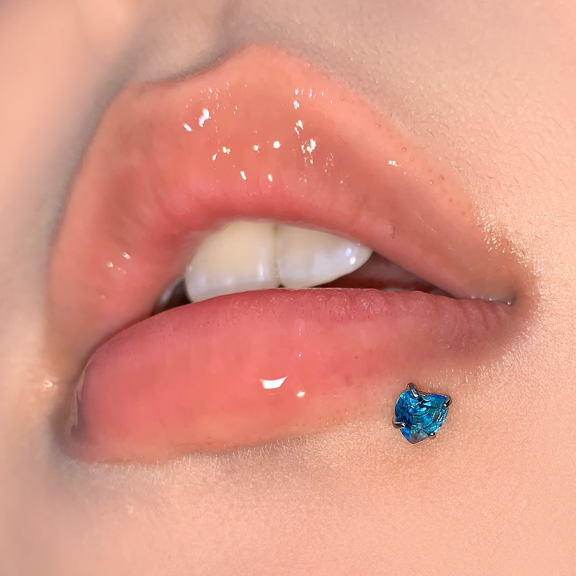 Silver pointed spike labret stud material detail