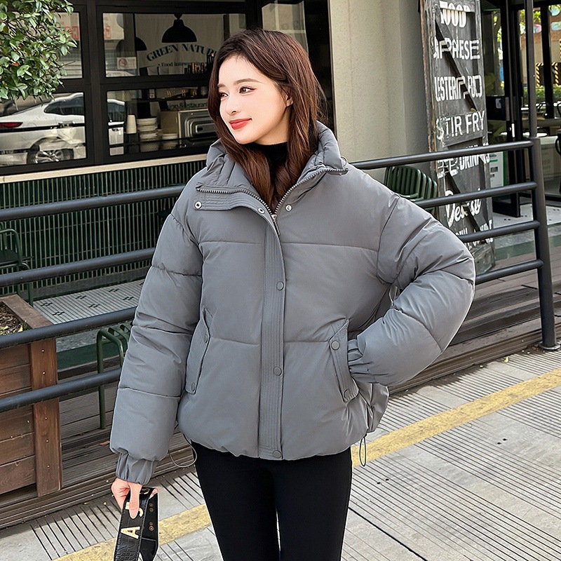 Invierno transfronterizo coreano 2025 nuevo abrigo de algodón de pluma de estilo universitario corto de mujer chaqueta de algodón de hombre pequeño Europa y América lote