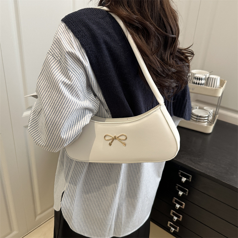 Bolso de axila con lazo para mujer 2025 nuevo bolso de bola de masa de lujo simple y ligero de alta calidad textura bolso de mensajero de un solo hombro marea