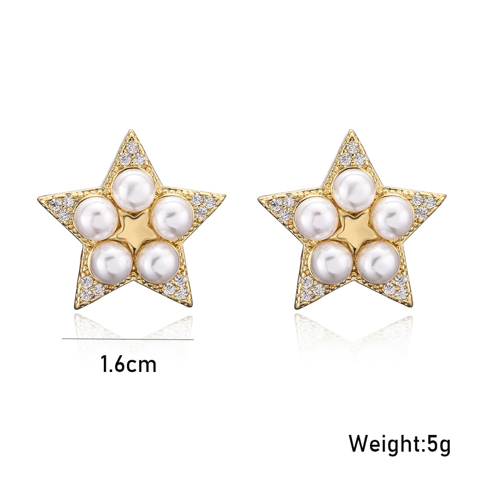 Golden Copper Micro-inlaid Zircon Pearl Five-pointed Star Stud Earrings display picture 1