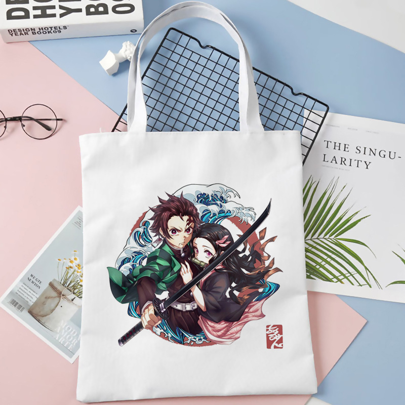 Comercio exterior transfronterizo Demon Slayer impresa bolsa de lona Harjuku bolsa de hombro bolsa de compras portátil de moda para estudiantes