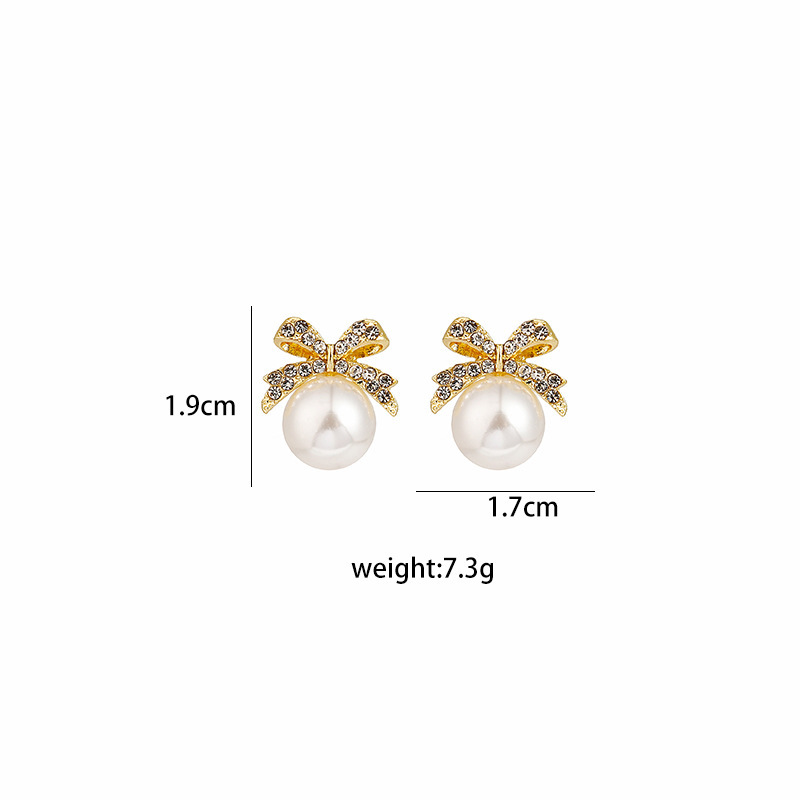 Women's Sweet Bow Knot Alloy Rhinestones Earrings Pearl Metal Diamond Stud Earrings display picture 1
