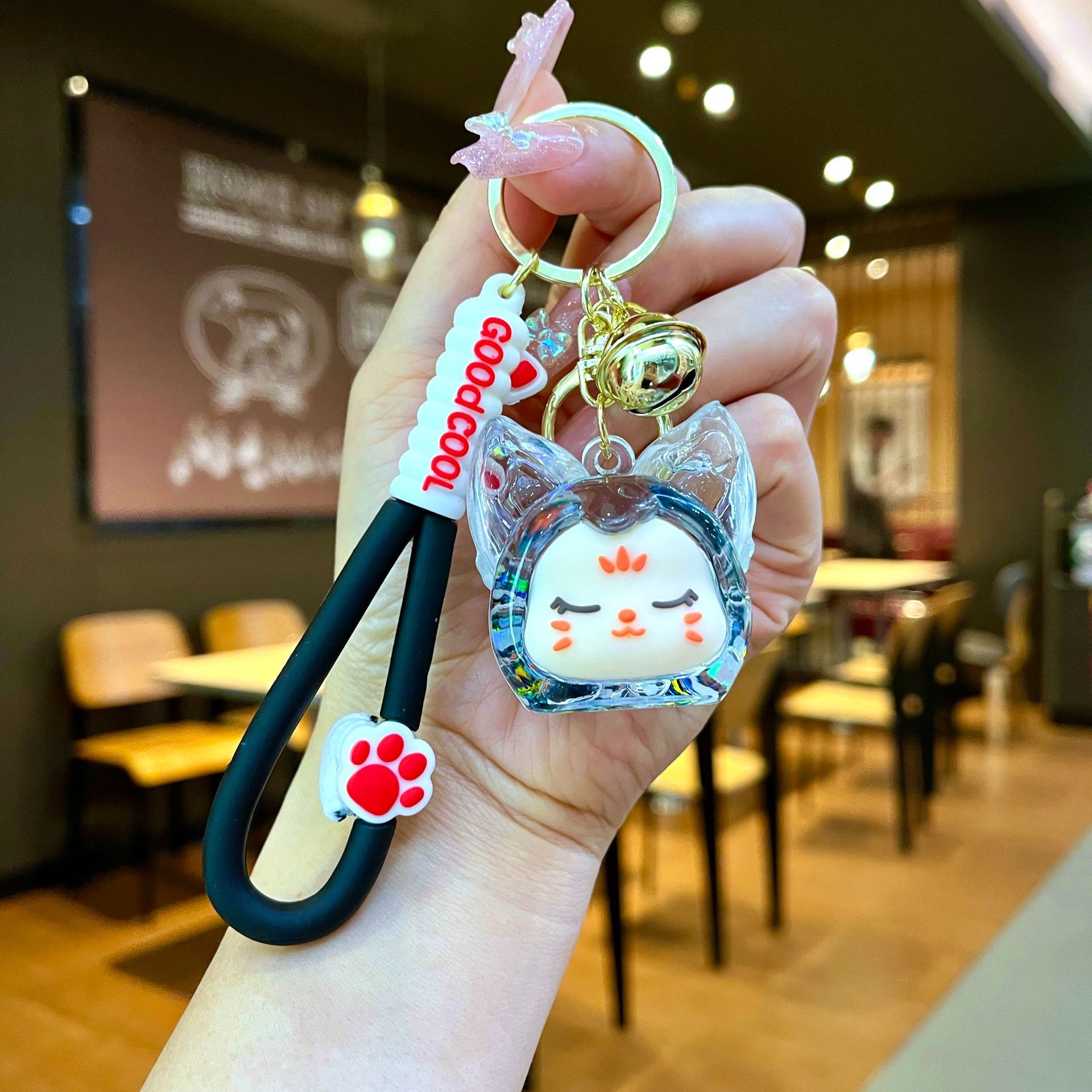 Aceite de gato garra arenas movedizas llavero lindo dibujos animados cadena colgante captura muñeca máquina agarrar pequeño regalo al por mayor