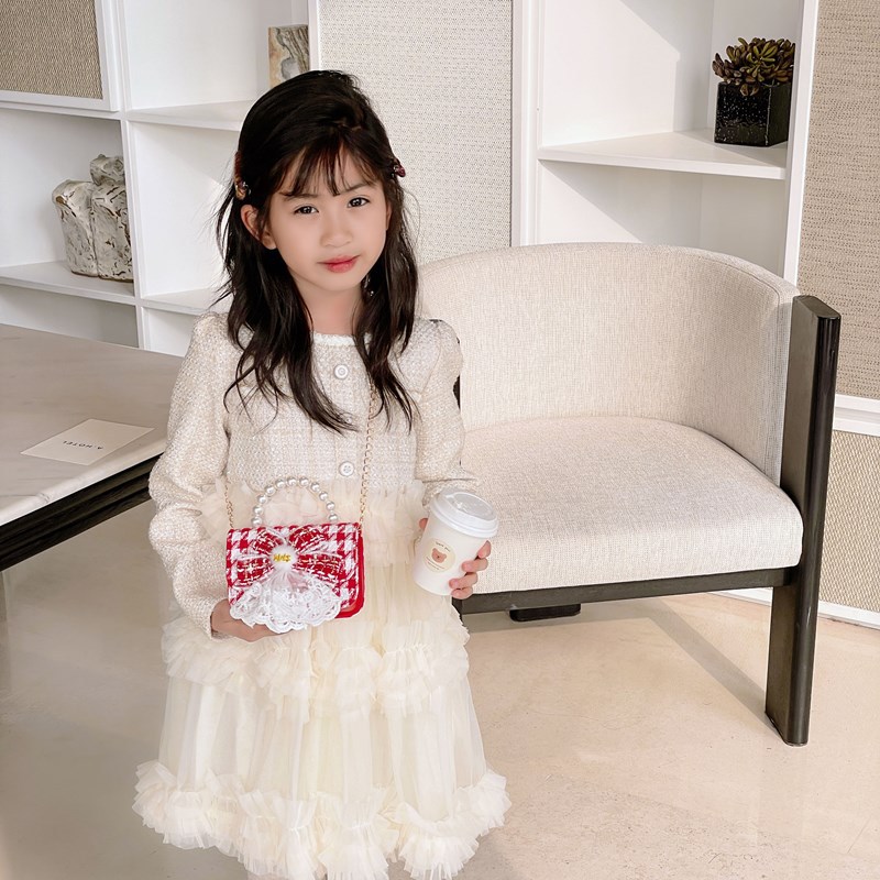 Nuevo bolso de hombro de niñas lindo arco bolso de perla bebé 2025 bolso rojo pequeño viento perfumado bolso para niños