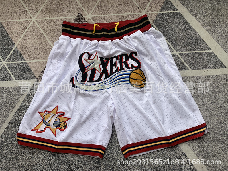 Comercio exterior pantalones de fútbol al por mayor Warriors Lakers 76 caliente Raptor mágico bolsillo bordado pantalones cortos pantalones de baloncesto NFL