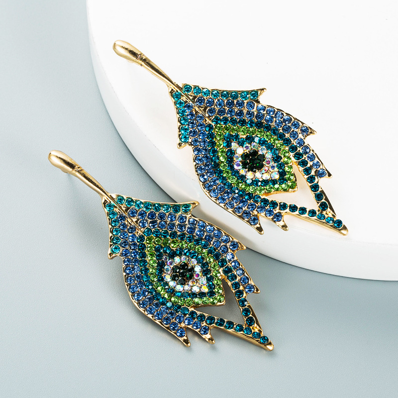 fashion color alloy rhinestone leaf eye trendy stud earrings wholesale