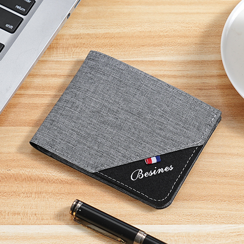 Cartera de color en contraste para hombre corta 2025 nueva marca de moda joven estudiante personalidad simple clip de camioneta plegable ultrafino