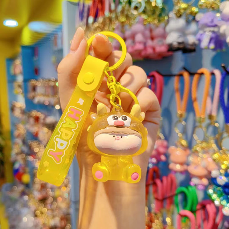 Caricatura Lilith dragón lindos colgantes de resina transparente bolsos de automóviles colgantes de llaves al por mayor