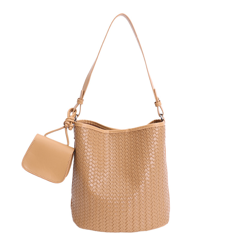 Diseño coreano de nicho de tejido bolso de cubo de agua de mujer nueva textura de alta calidad de hombro versátil bolso de tramo inclinado
