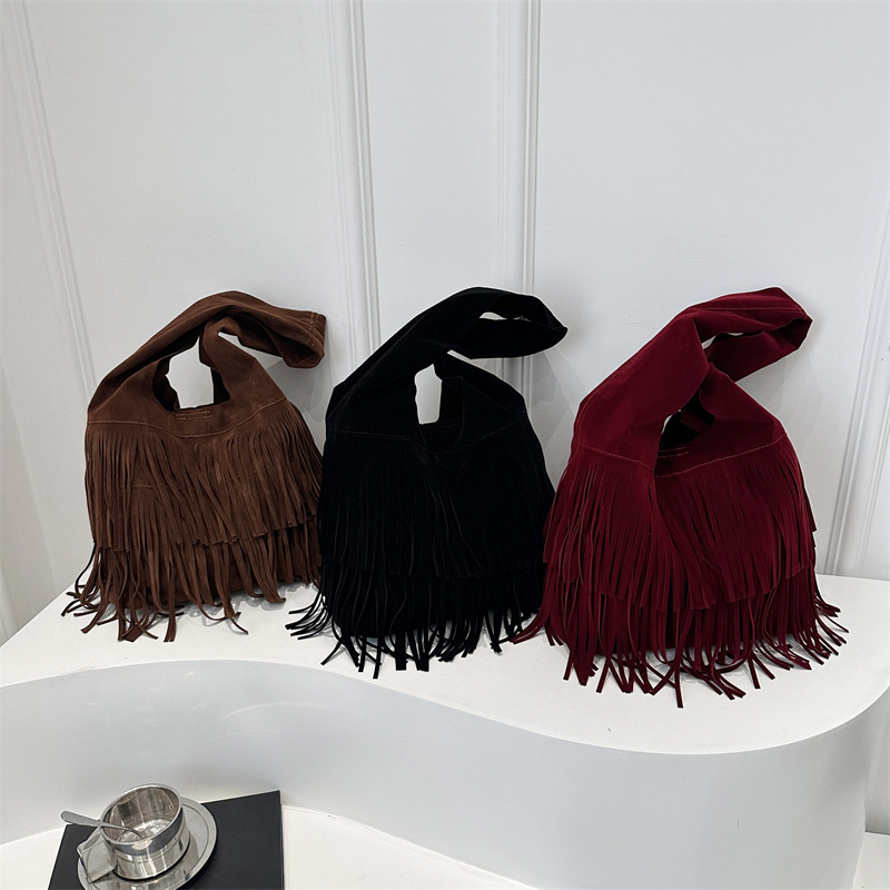 2025 primavera nueva moda texturas retro simple gran capacidad relajada humedad bolso de hombro de mujer